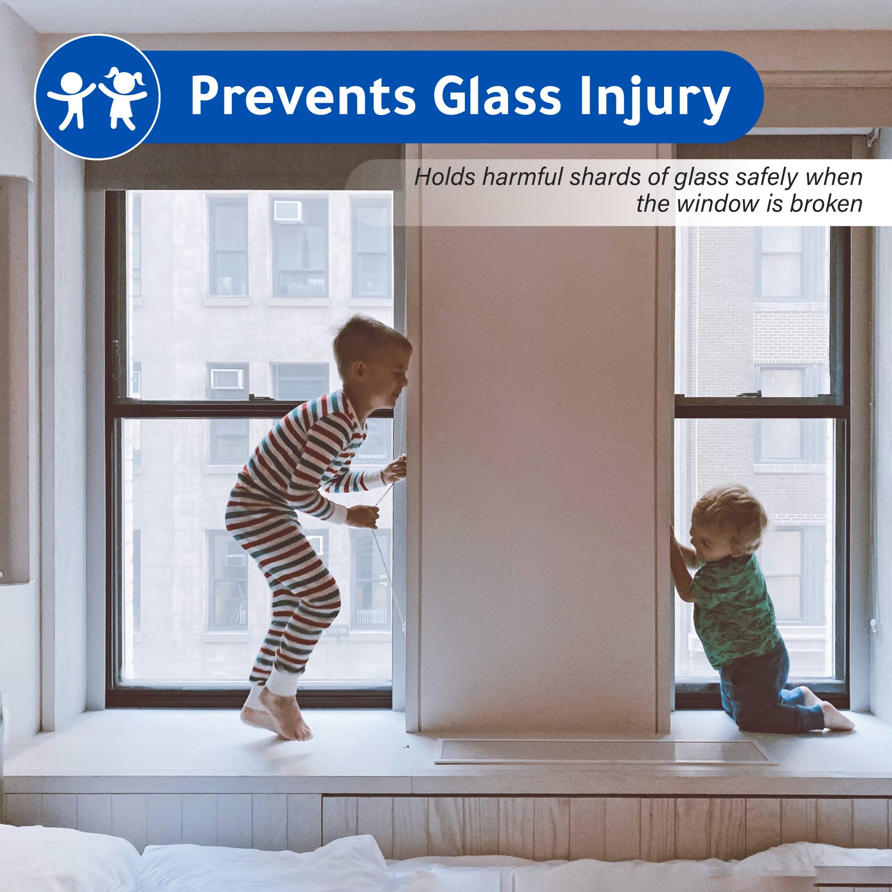 Children playing by a window with safety film installed