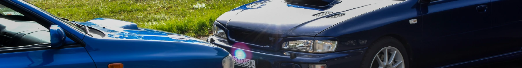 Two cars bumper to bumper with Subaru window tint installed 